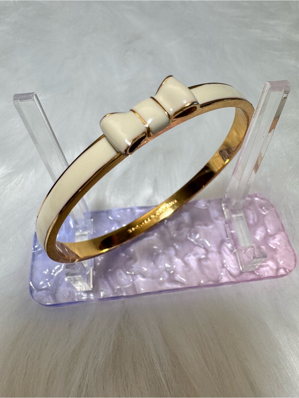 Kate spade Gold-Tone Bangle Bracelet with Cream Enamel Bow Accent